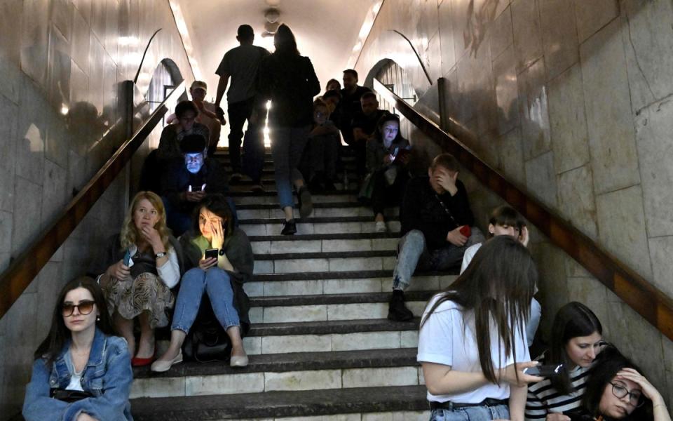 Residents take shelter in a metro station (AFP via Getty Images)