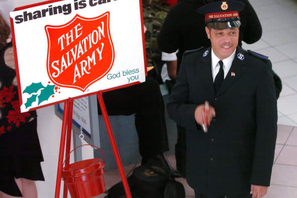 Salvation Army bell ringer, Rickie Armour, collects donation