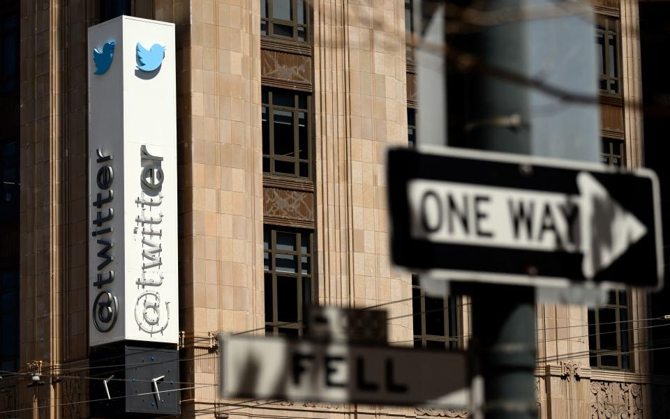 Part of the Twitter sign is removed on the side of its headquarters building in San Francisco.