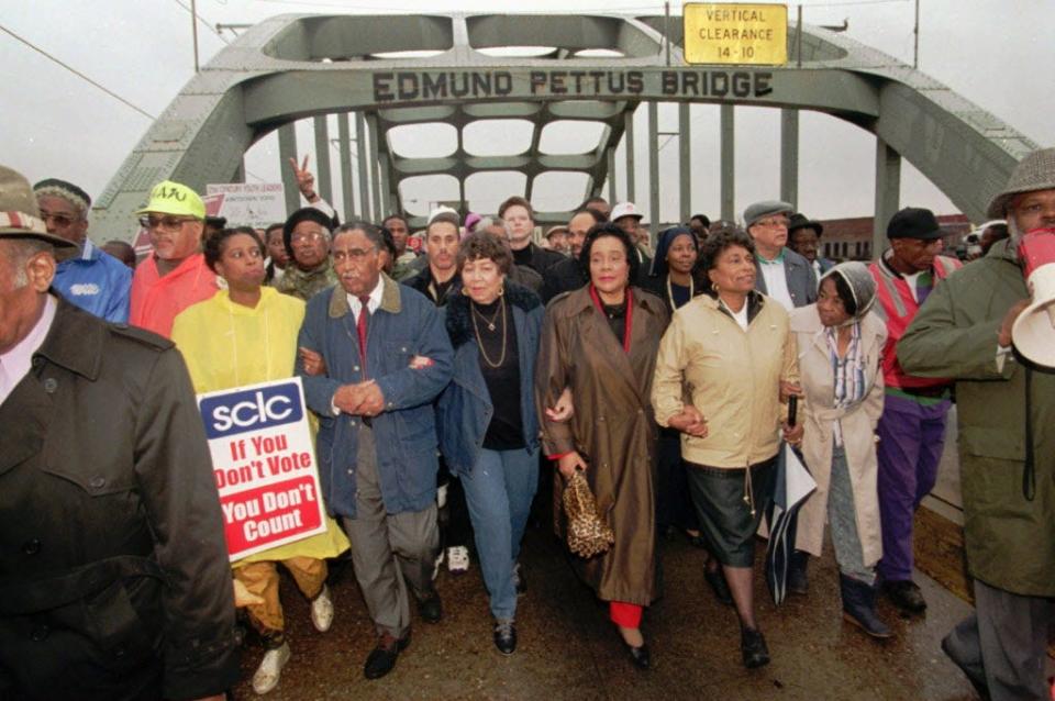U.S. Rep. Cynthia McKinney, D-Ga.; SCLC President Joseph Lowery; Evelyn Lowery; Coretta Scott King; U.S. Rep. Eve Clayton,-D-N.C.; and Marie Foster cross the Edmund Pettus Bridge in Selma, Ala.,  to commemorate the 30th anniversary of the Selma-to-Montgomery civil rights march in 1995.