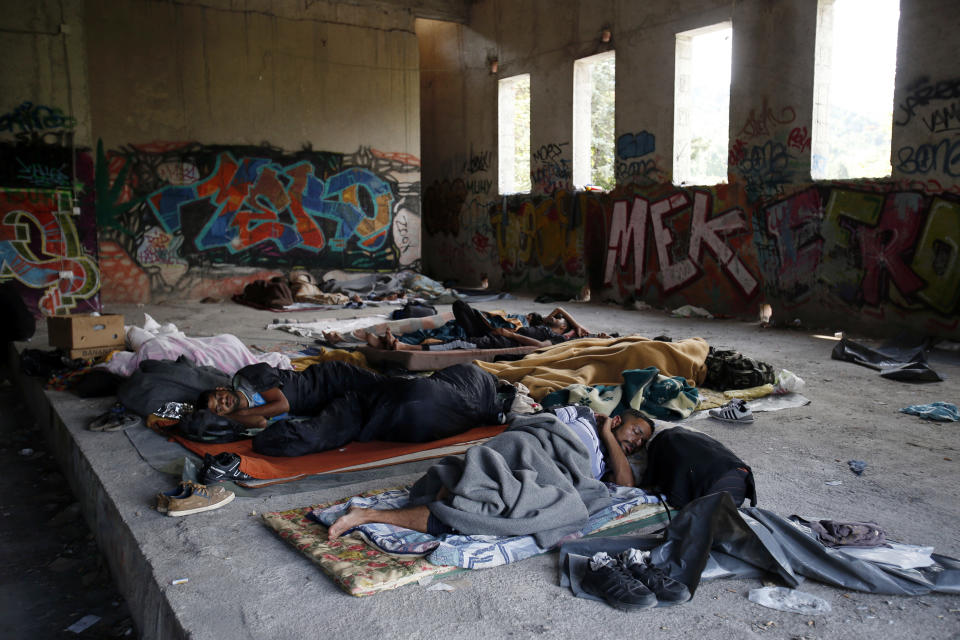 In this photo taken on Tuesday, Aug. 14, 2018, migrants sleep on the floor of a makeshift migrant camp in Bihac, 450 kms northwest of Sarajevo, Bosnia. Impoverished Bosnia must race against time to secure proper shelters for at least 4,000 migrants and refugees expected to be stranded in its territory during coming winter. The migrant trail shifted toward Bosnia as other migration routes to Western Europe from the Balkans were closed off over the past year. (AP Photo/Amel Emric)