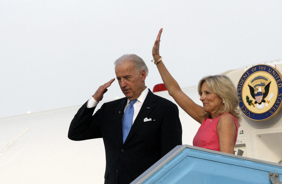 U.S. Vice President Joe Biden (L) and his wife Jill gesture before boarding a plane at Ben Gurion International airport near Tel Aviv March 11, 2010. Biden called on Thursday for Israeli-Palestinian peace talks to start without delay despite Palestinian insistence that Israel first cancel a settlement project condemned by Washington.&nbsp;