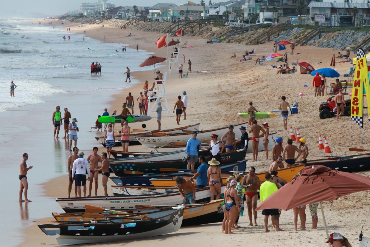 In this 2018 file photo, lifeguards from all over Florida compete in a run up to the United States Lifesaving Association's regional championships in Flagler Beach.