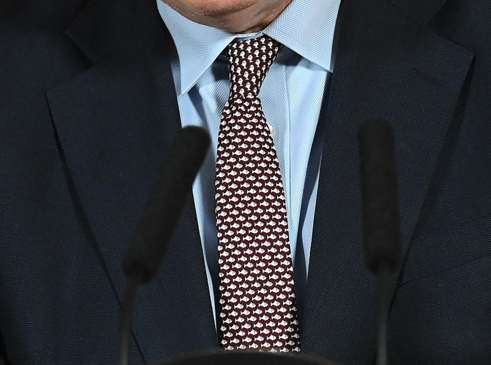 Britain's Prime Minister Boris Johnson, wears a tie with a motif of fishes, as he speaks during a media briefing in Downing Street, London, Thursday, Dec. 24, 2020. Britain and the European Union have struck a provisional free-trade agreement that should avert New Year's chaos for cross-border commerce and bring a measure of certainty to businesses after years of Brexit turmoil. The breakthrough on Thursday came after months of tense and often testy negotiations that whittled differences down to three key issues: fair-competition rules, mechanisms for resolving future disputes and fishing rights. (Paul Grover/Pool Photo via AP)