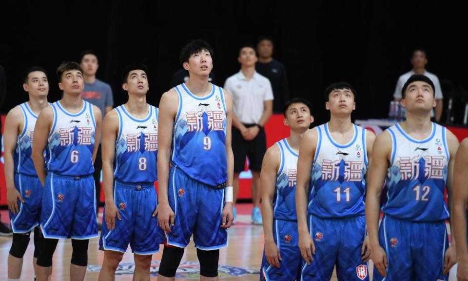 Xinjiang Flying Tigers line up before a match against Jilin Northeast Tigers at the 2020-2021 season of the Chinese Basketball Association (CBA) league in Zhuji, Zhejiang Province, on 15 January 2021.