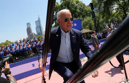 U.S. Democratic presidential candidate and former Vice President Joe Biden runs up the steps onto the stage to begin the kickoff rally of his campaign for the 2020 Democratic presidental nomination in Philadelphia, Pennsylvania, U.S., May 18, 2019. REUTERS/Jonathan Ernst TPX IMAGES OF THE DAY