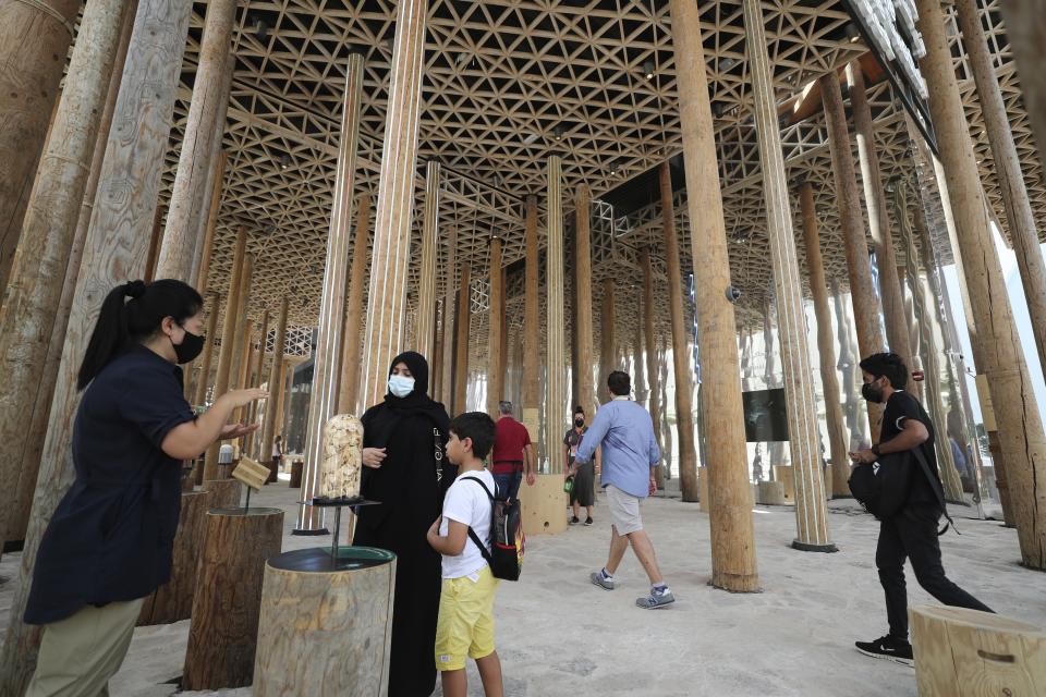People visit the Brazil Pavilion at the Dubai Expo 2020, in Dubai, United Arab Emirates, Sunday, Oct, 3, 2021. (AP Photo/Kamran Jebreili)