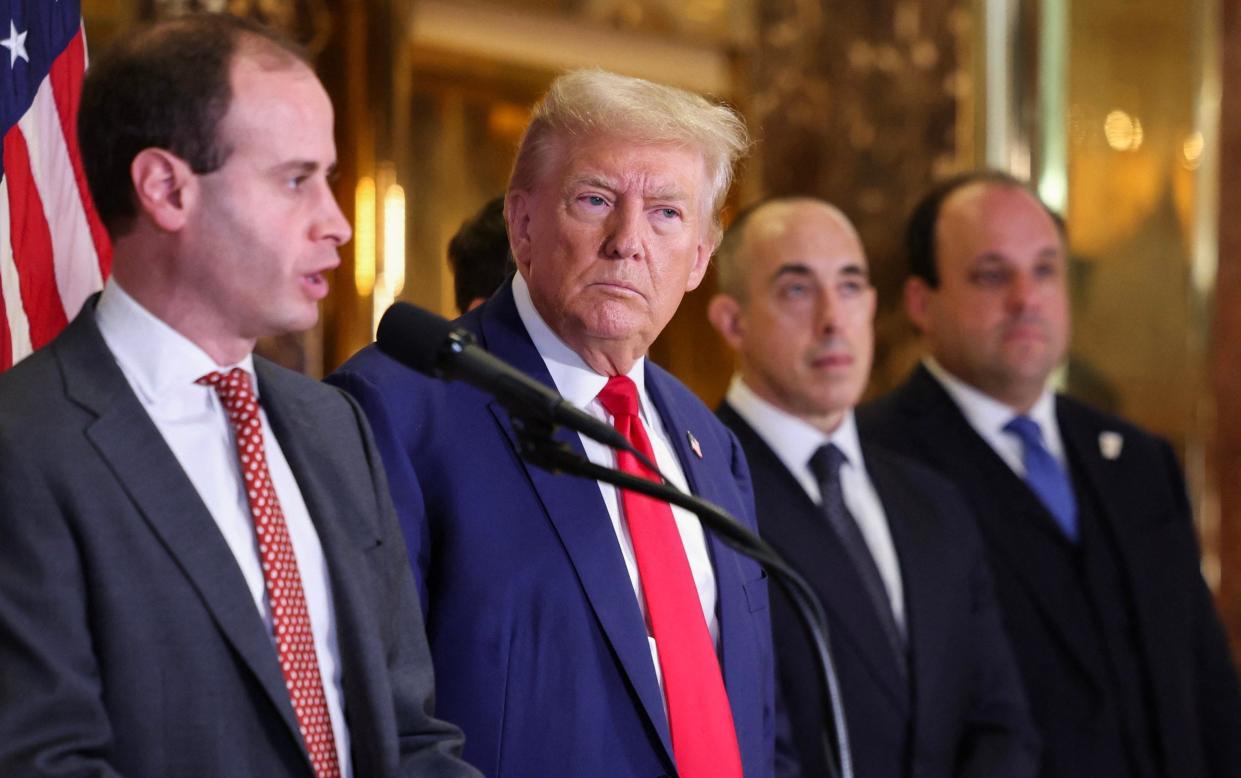 Donald Trump with his legal team at a press conference at Trump Tower in New York