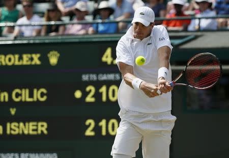 John Isner of the U.S.A. hits a shot during his match against Marin Cilic of Croatia at the Wimbledon Tennis Championships in London, July 4, 2015. REUTERS/Stefan Wermuth