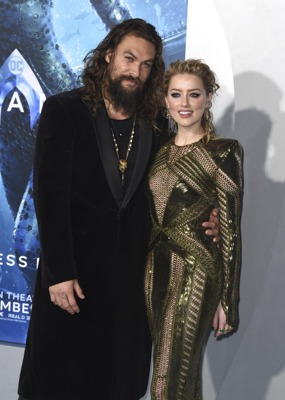 Jason Momoa, left, and Amber Heard arrive at the premiere of "Aquaman" at TCL Chinese Theatre on Wednesday, Dec. 12, 2018, in Los Angeles. (Photo by Jordan Strauss/Invision/AP)