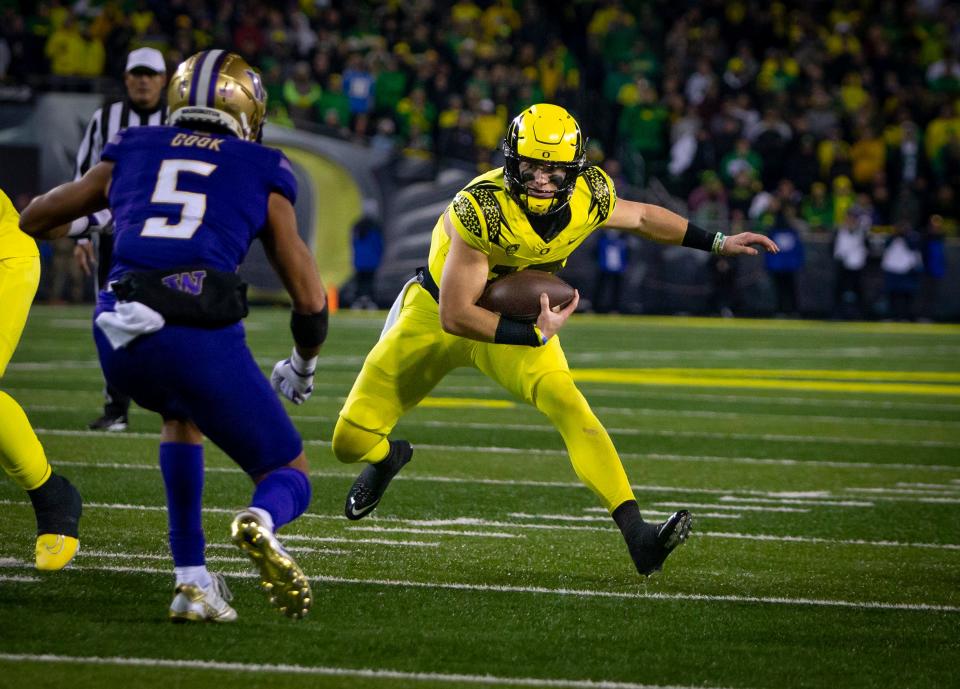 Oregon quarterback Bo Nix scrambles with the ball as the No. 6 Oregon Ducks host the No. 24 Washington Huskies Saturday, Nov. 12, 2022, at Autzen Stadium in Eugene, Ore. 