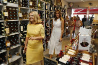 U.S. First Lady Melania Trump and Malgorzata Tusk, left, wife of European Council President Donald Tusk arrive with leaders' spouses in a wine shop in the Basque village of Espelette, near Biarritz, southwestern France, Sunday Aug. 25, 2019. Leaders of major democracies are meeting to discuss the shaky world economy amid trade disputes, rising tensions with Iran and uncertainty over U.S. President Donald Trump's go-it-alone policies. (Regis Duvignau/Pool via AP)