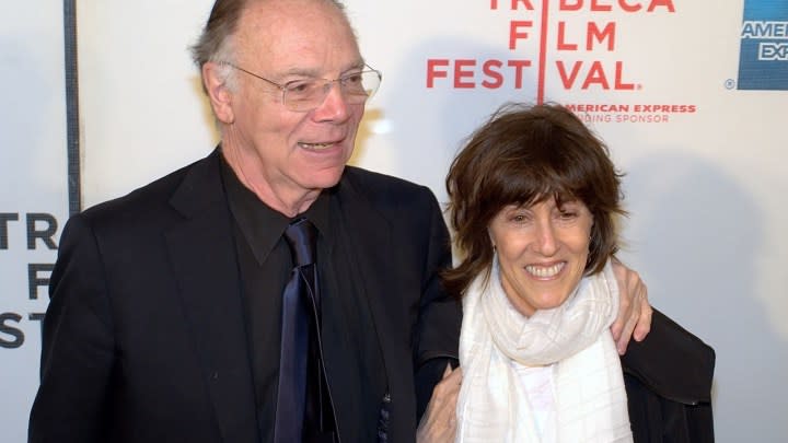 Nora Ephron standing beside Nicholas Pileggi and the 2010 Tribeca Film Festival red carpet.