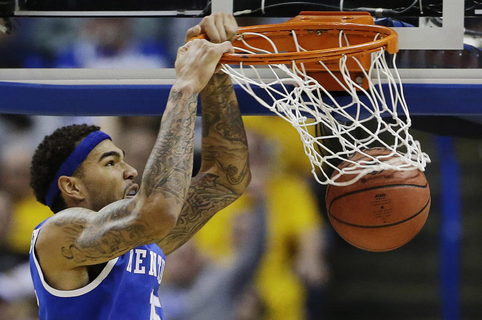 Kentucky forward Willie Cauley-Stein (15) dunks against Wichita State during the second half of a third-round game of the NCAA college basketball tournament Sunday, March 23, 2014, in St. Louis. (AP Photo/Jeff Roberson)