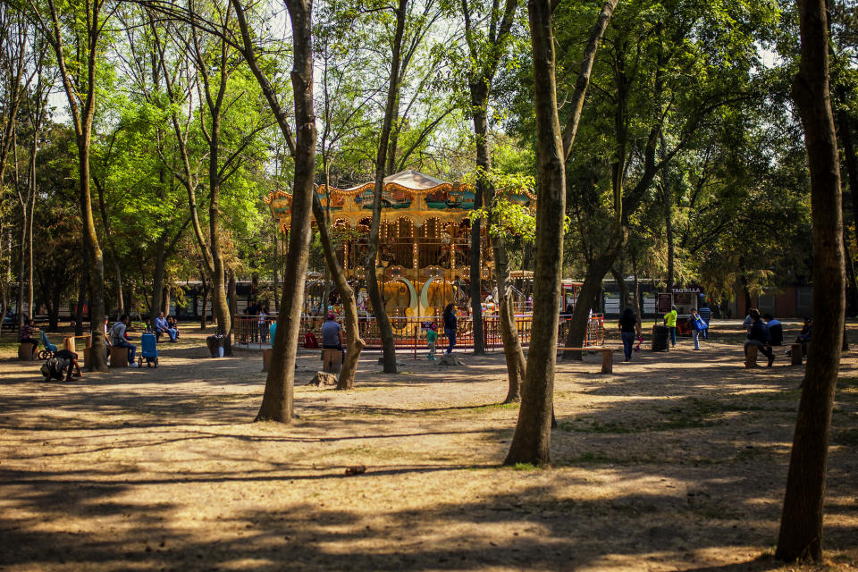 This is a Carousel in the middle of Chapultepec park, is in the middle of the forest on its own, we can see trees and in the middle the Carousel.