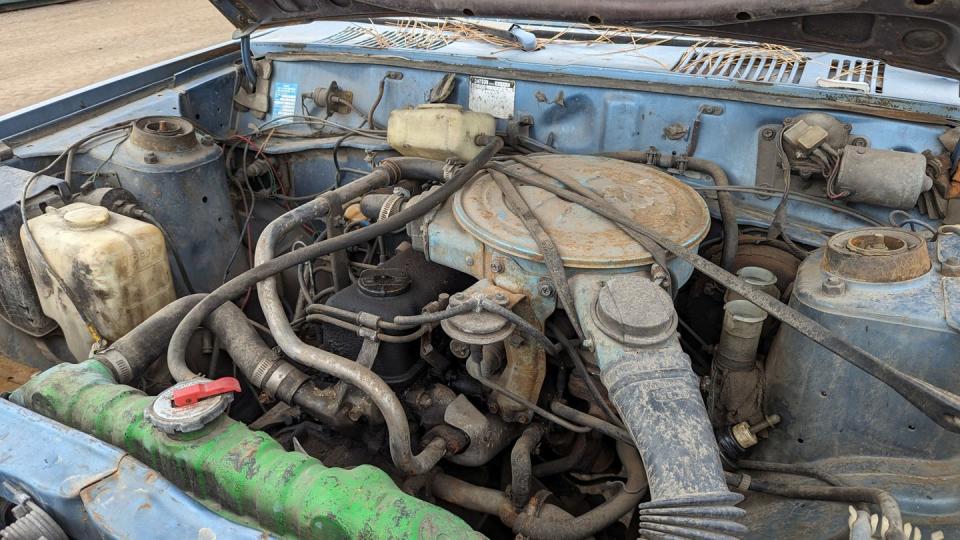 1980 datsun 210 wagon with 400k miles in colorado junkyard