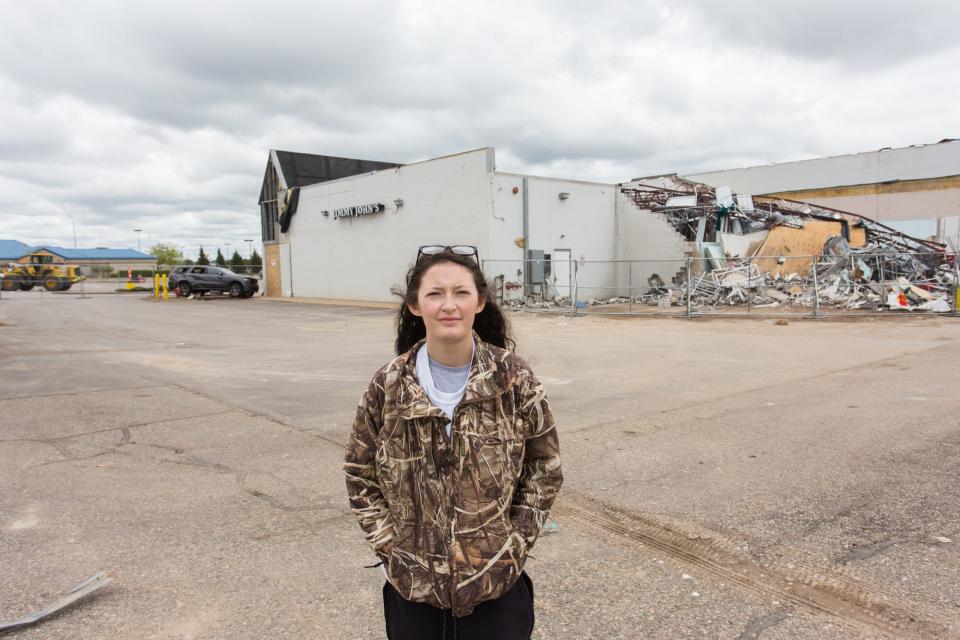 Triniti Johnson, 17, of Gaylord, stands near Jimmy John's, and other businesses, along West Main Street Sunday, May 22, 2022 after a tornado touched down in Gaylord. Johnson was working at Jimmy John's during the storm. "It was deafening," Johnson said. "Right when it passed, all you could hear where alarms going off. Yelling and alarms, that's it," she said. 