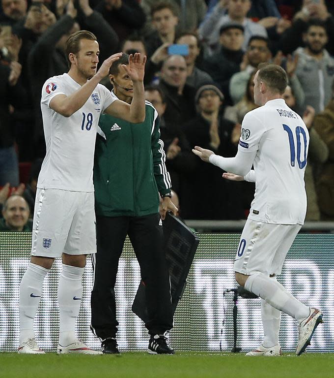 Harry Kane (left) comes on as substitute for Wayne Rooney during the match against Lithuania