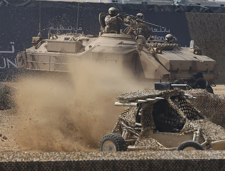 Members of the United Arab Emirates' armed forces take part in a military show launching the International Defence Exhibition and Conference (IDEX) at the Abu Dhabi National Exhibition Centre in the Emirati capital on February 17, 2013.