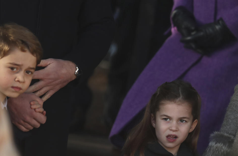 Britain's Prince George and Princess Charlotte, children of the Duke and Duchess of Cambridge after attending a Christmas day service at the St Mary Magdalene Church in Sandringham in Norfolk, England, Wednesday, Dec. 25, 2019. (AP Photo/Jon Super)