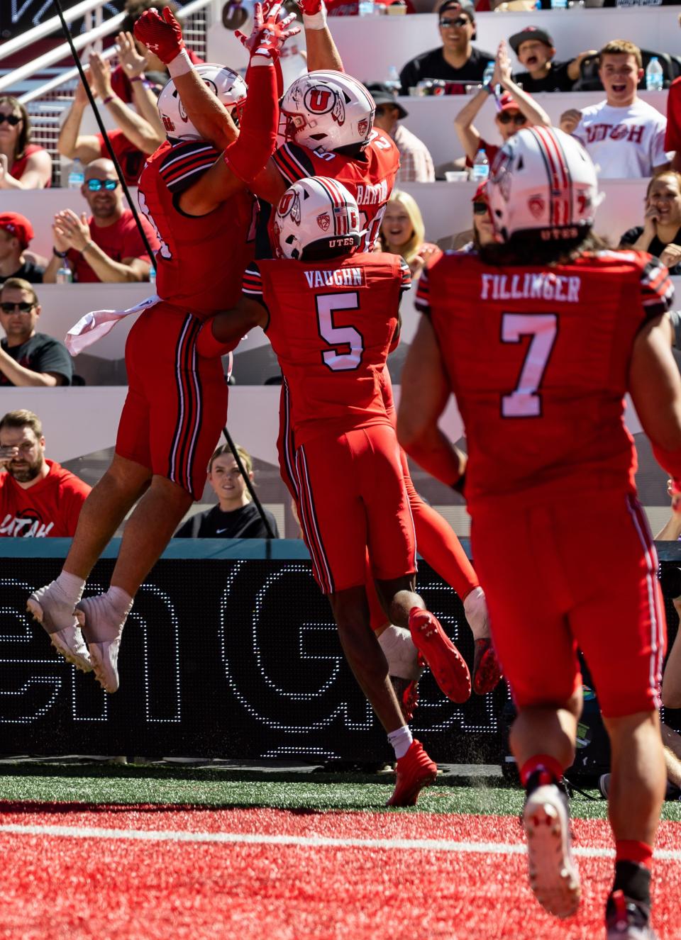 Utah Utes teammates celebrate Utah Utes linebacker Lander Barton (20) after his interception and touchdown during the third quarter of their game against the Weber State Wildcats at Rice-Eccles Stadium in Salt Lake City on Saturday, Sept. 16, 2023. The Utah Utes won the game with a final score of 31-7. | Megan Nielsen, Deseret News