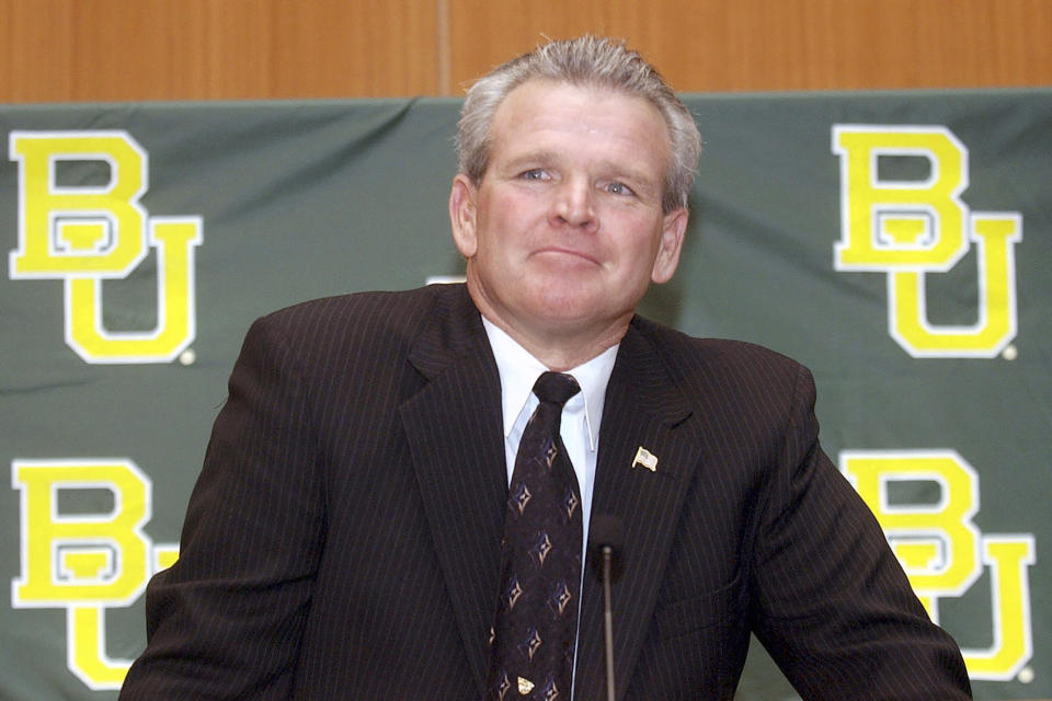 FILE - New Baylor head football coach Guy Morriss makes a statement following his introduction at press conference at Baylor's Umphrey Law Center Wednesday Dec, 11, 2002. Guy Morriss, a 15-year NFL offensive lineman who started Super Bowl XV for the Philadelphia Eagles before coaching collegiately at Baylor and Kentucky, has died. He was 71. Kentucky athletics spokesman Tony Neely confirmed Morriss’ death on Tuesday, Sept. 6, 2022, after being informed by his family. (Duane A. Laverty/Waco Tribune-Herald via AP, File)
