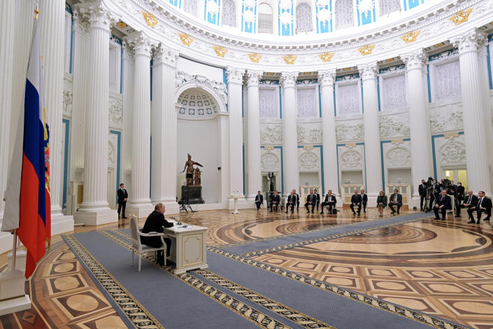 Russian President Vladimir Putin, left, chairs a Security Council meeting in the Kremlin in Moscow, Russia, Monday, Feb. 21, 2022. (Sputnik, Kremlin Pool Photo via AP) 