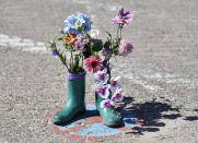 In this photo taken on Wednesday, May 15, 2019, flowers in boots are pictured in a no parking zone on the environmental island Langeoog in the North Sea, Germany. Concerns about climate change have prompted mass protests across Europe for the past year and are expected to draw tens of thousands onto the streets again Friday, May 24. For the first time, the issue is predicted to have a significant impact on this week’s elections for the European Parliament. (AP Photo/Martin Meissner)