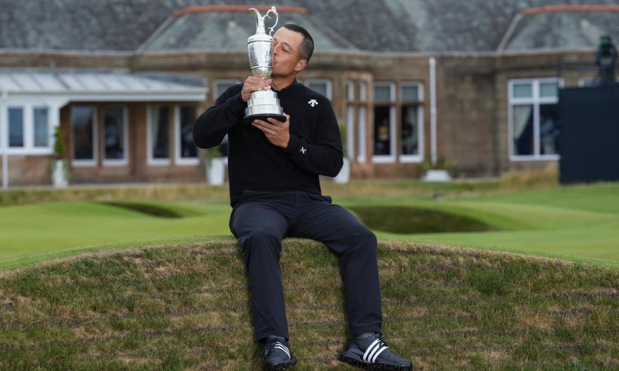 <span>Xander Schauffele celebrates with the Claret Jug trophy after adding the Open to the PGA Championship he won earlier this year.</span><span>Photograph: Jon Super/AP</span>