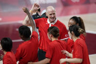 Japan head coach Thomas Hovasse celebrates with his team at the end of a women's basketball quarterfinal round game against Belgium at the 2020 Summer Olympics, Wednesday, Aug. 4, 2021, in Saitama, Japan. (AP Photo/Charlie Neibergall)