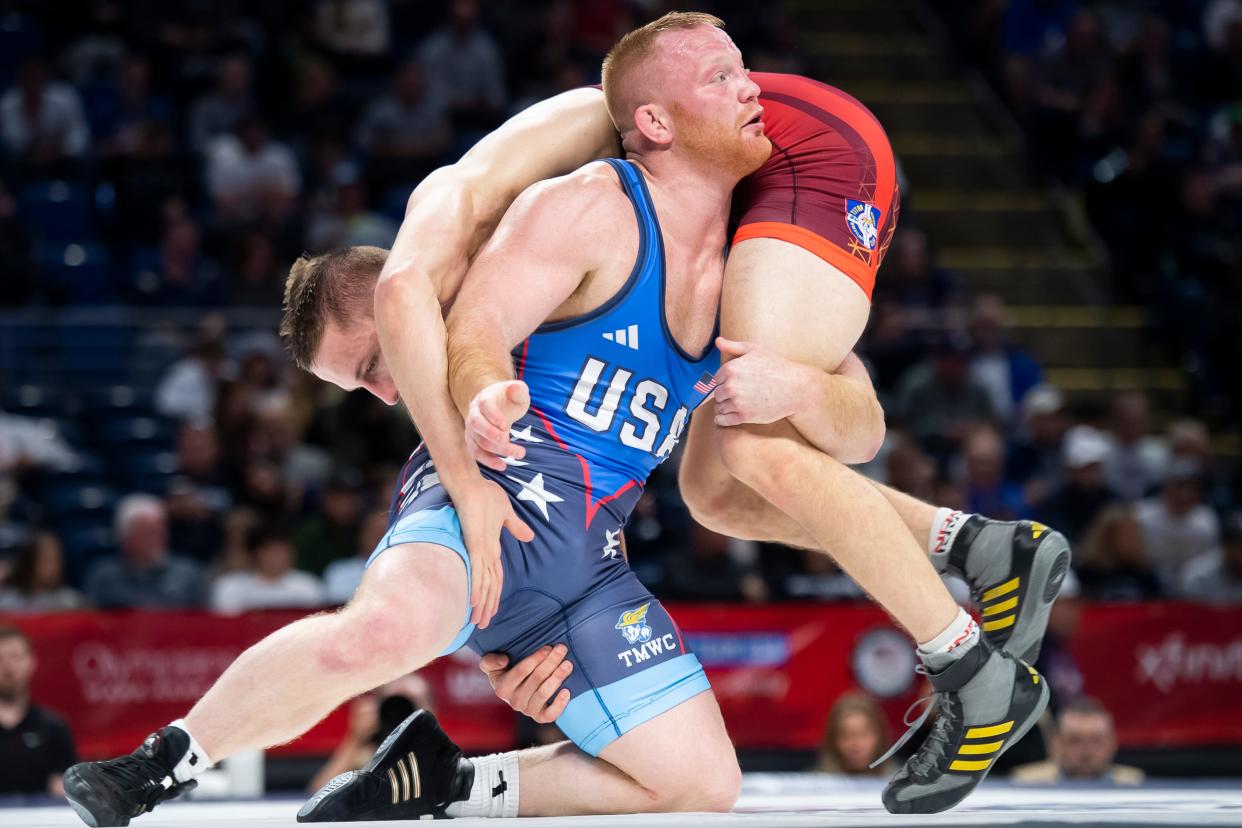 Chance Marsteller (front) wrestles Evan Wick in a 86 kilogram challenge round quarterfinal bout during the U.S. Olympic Team Trials at the Bryce Jordan Center April 19, 2024, in State College. Marsteller won by decision, 6-0.