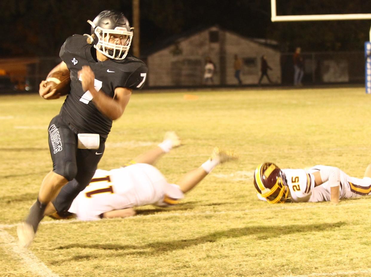 Water Valley High School's Canon Wiese (7) tries to stay inbounds on a sweep play as he looks upfield for more yardage in a Class 1A Division I regional semifinal playoff football game against Lometa on Friday, Nov. 19, 2021 at Sanders Field in Eden.