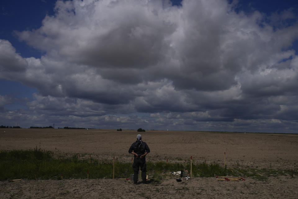 A mine detection worker with The HALO Trust demining NGO takes a break from searching for anti-tank and anti-personnel landmines in Lypivka, on the outskirts of Kyiv, Ukraine, June 14, 2022. / Credit: Natacha Pisarenko/AP