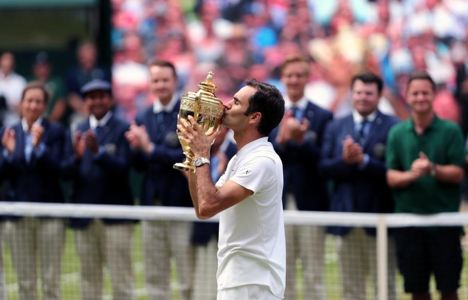 Federer with the Wimbledon trophy is 2017. He has won 20 grand slam singles titles (Gareth Fuller/PA). (PA Wire)