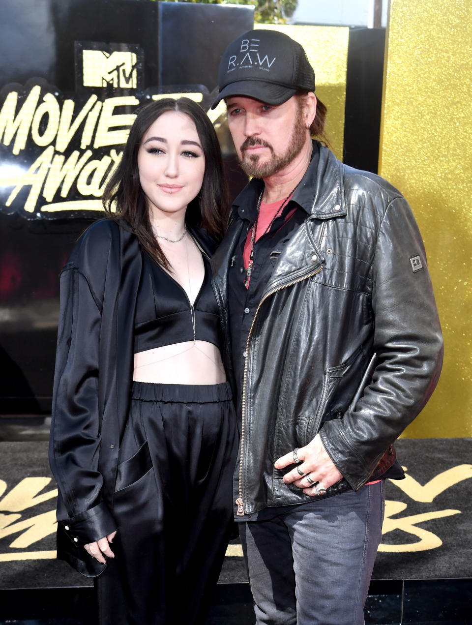 Actor/singers Noah Cyrus (L) and Billy Ray Cyrus attend the 2017 MTV Movie And TV Awards at The Shrine Auditorium on May 7, 2017 in Los Angeles, California.&nbsp;