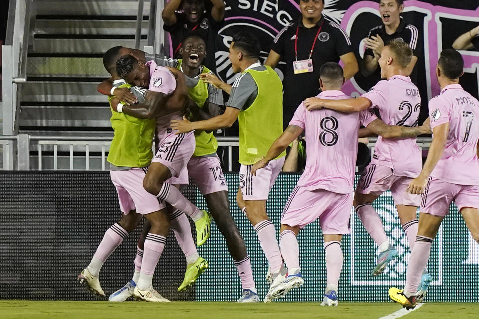 Inter Miami midfielder Emerson Rodríguez (25) is hugged by a teammate after scoring against Charlotte FC during the second half of an MLS soccer match Saturday, July 16, 2022, in Fort Lauderdale, Fla. (AP Photo/Marta Lavandier)