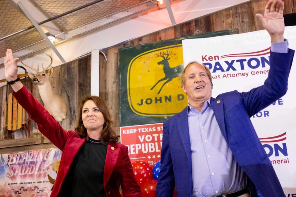 Sen. Angela Paxton and husband Attorney General Ken Paxton wave to the crowd Nov. 8, 2022, during a Collin County GOP Election Night Watch Party at Haggard Party Barn in Plano, Texas.