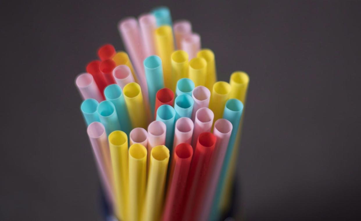 A new Calgary bylaw stipulating that all retail shops, grocers, restaurants, cafes and drive-thrus must charge for bags came into effect Jan. 16. The bylaw also requires that businesses ask their customers if they want accessories, like napkins, straws and cutlery, rather than automatically supplying them.   (The Canadian Press - image credit)