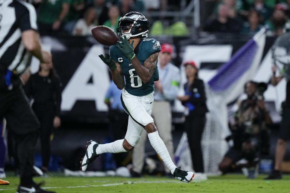 Philadelphia Eagles wide receiver DeVonta Smith (6) catches the ball and runs for a touchdown during the second half of an NFL football game against the Minnesota Vikings on Thursday, Sept. 14, 2023, in Philadelphia. (AP Photo/Matt Slocum)