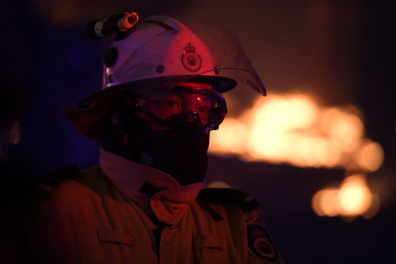 NSW Rural Fire Service crews protect properties on Waratah Road and Kelyknack Road as the Three Mile fire approaches Mangrove Mountain