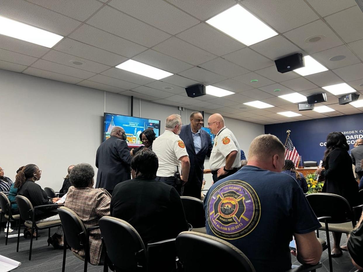 Firefighters greet former Congressman Al Lawson at the Gadsden County legislative delegation meeting in January 2023