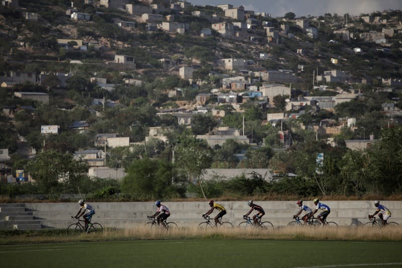 The Wider Image: Haiti's cyclists brave protests and poor roads in race for gold