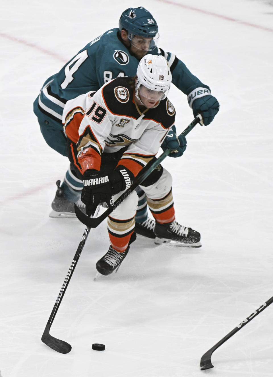 Anaheim Ducks right wing Troy Terry (19) vies for the puck against San Jose Sharks defenseman Jan Rutta (84) during the second period of an NHL hockey game Saturday, Jan. 20, 2024, in San Jose, Calif. (AP Photo/Nic Coury)