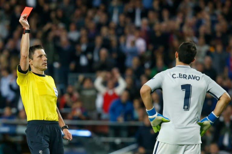 Referee shows red card to Manchester City's goalkeeper Claudio Bravo during the UEFA Champions League match FC Barcelona vs Man City, at the Camp Nou stadium in Barcelona, on October 19, 2016