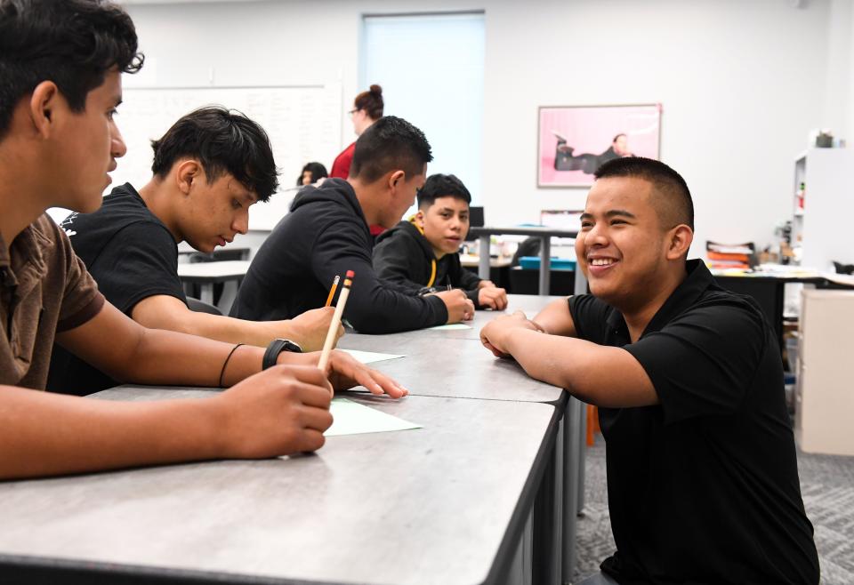 Fernando Perez, senior at Jefferson, tutors fellow students in an English for English Learners class on Thursday, May 19, 2022, in Sioux Falls.