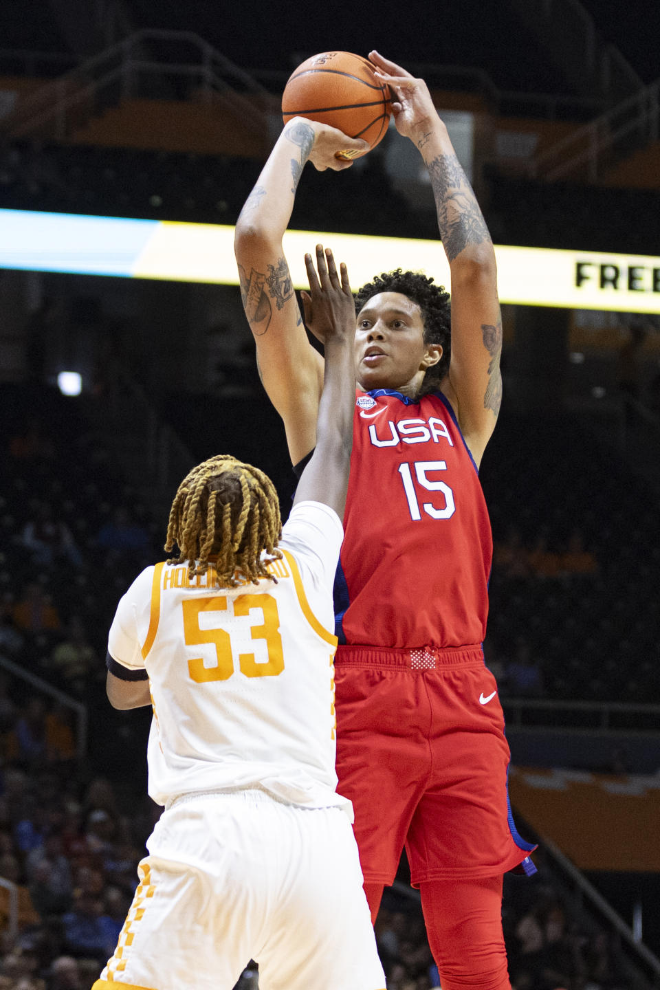 Team USA center Brittany Griner (15) goes to shoot over Tennessee forward Jillian Hollingshead (53) during the first half of an NCAA college basketball exhibition game, Sunday, Nov. 5, 2023, in Knoxville, Tenn. (AP Photo/Wade Payne)