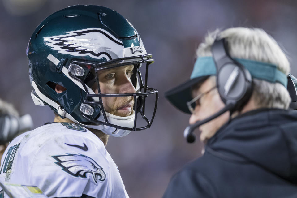 Eagles quarterback Nick Foles and head coach Doug Pederson talk on the sideline during their victory over Washington. (Getty)