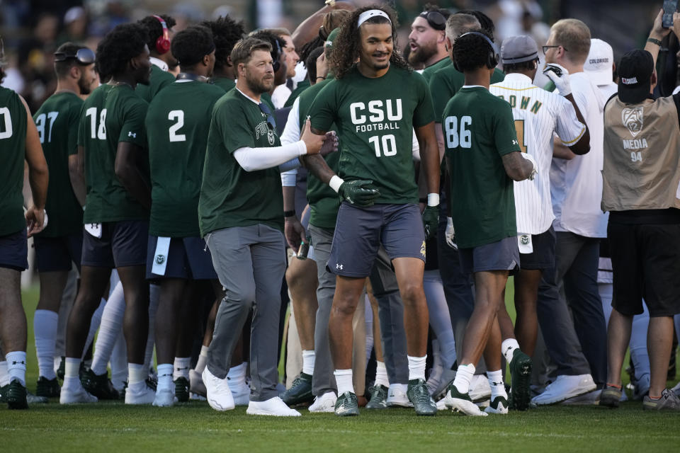 Colorado State tight end Vince Brown II (10) is led away from a scrum after exchanging words with players from Colorado before an NCAA college football game Saturday, Sept. 16, 2023, in Boulder, Colo. (AP Photo/David Zalubowski)