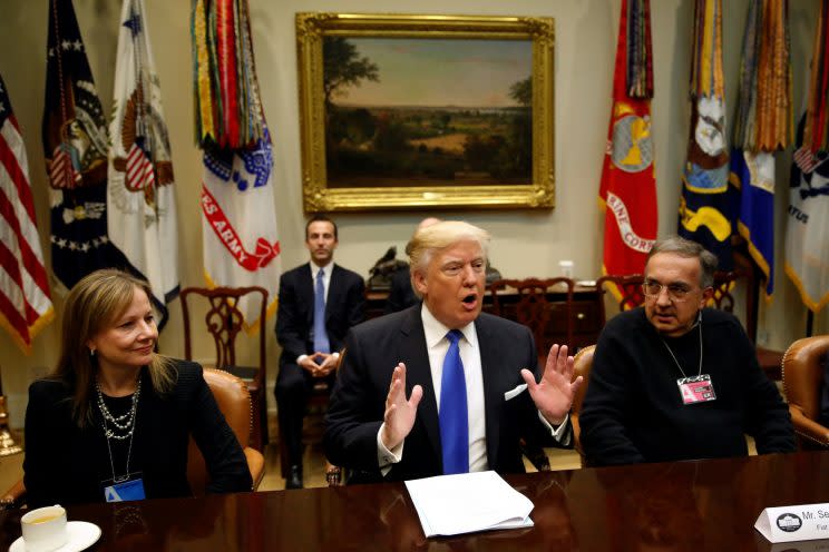 Flanked by General Motors CEO Mary Barra (L) and Fiat Chrysler CEO Sergio Marchionne (R), U.S. President Donald Trump hosts a meeting with U.S. auto industry CEOs at the White House in Washington January 24, 2017. (Photo: Kevin Lamarque/Reuters)