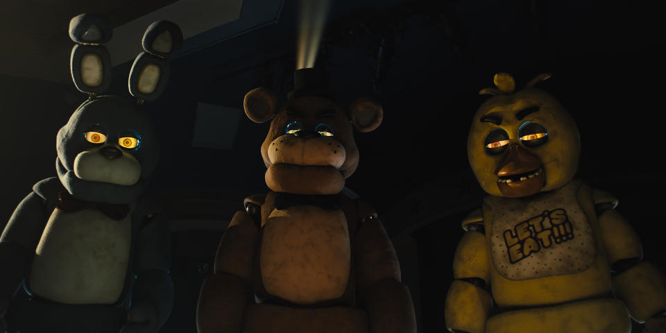 This image released by Universal Pictures shows, from left, Bonnie, Freddy Fazbear and Chica in a scene from "Five Nights at Freddy's." (Universal Pictures via AP)
